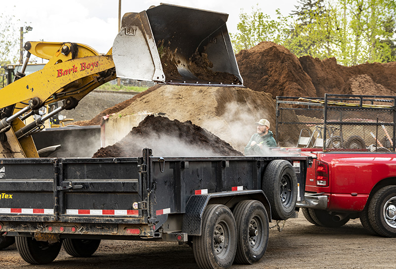 Loading up bark boys trailer with bark dust