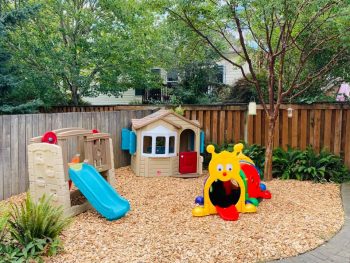 Children's playground with fresh bark chips