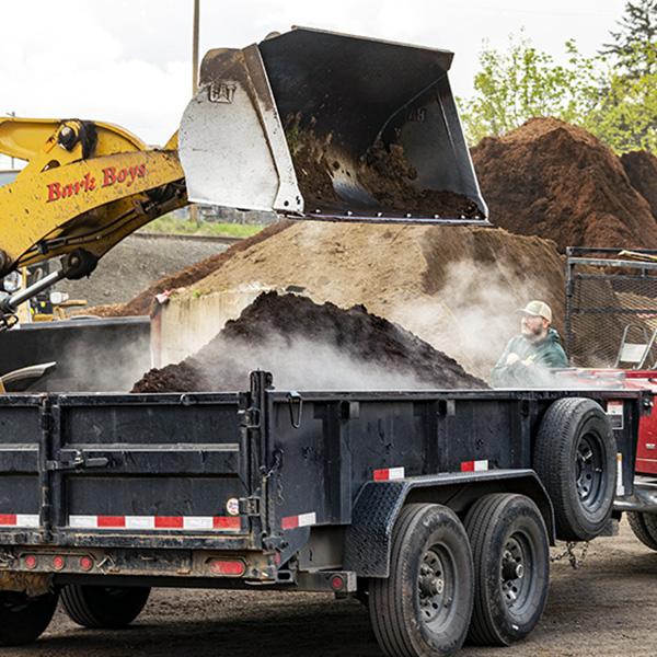 Loading up bark boys trailer with bark dust